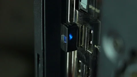 Blue light on Wi-Fi adapter connected to computer Stock Footage 103612846