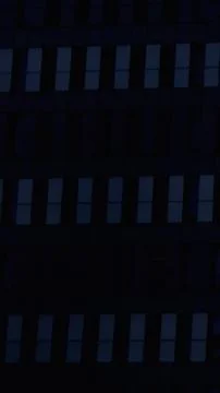 Blue light windows in the rows area of a building Stock Photos