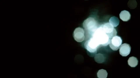 Blue lights bokeh on a black background. Abstract lights. Stock-Footage 302754760
