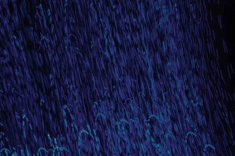 Blue lights as low speed shutter as a background. Stock Photos