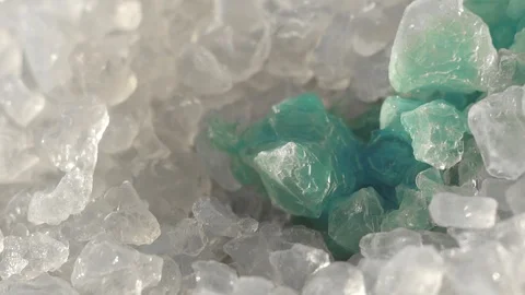 Blue liquid is absorbed by white granules with silica gel crystals Video stock 99189111