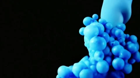 Blue liquid animation forming bubble granules on a black background Stock Footage 280721747