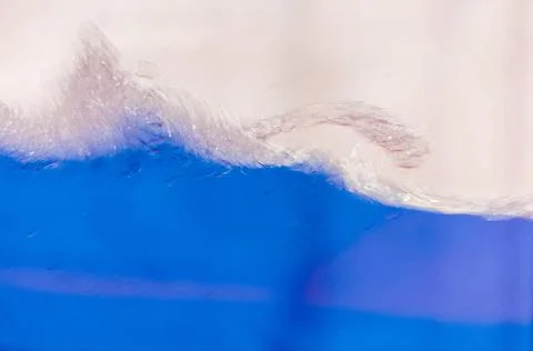 Blue liquid in the container Close up of a blue liquid, water, background ... Stock Photos