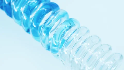 Blue liquid flows down a glass spiral pipe. Stock Footage 248319602