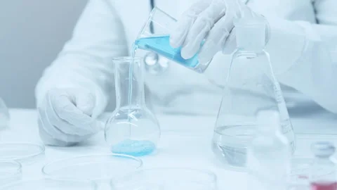Blue liquid in glass of flask.  Stock Footage 248307169