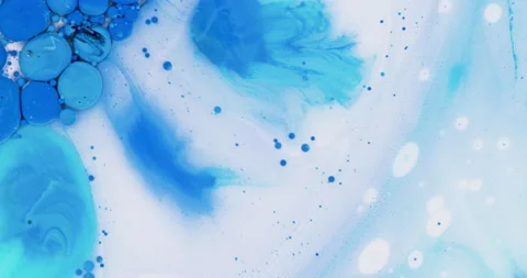 Blue liquid ink bubble reaction with soap and milk in 4K / 2X Stock Footage 136270930