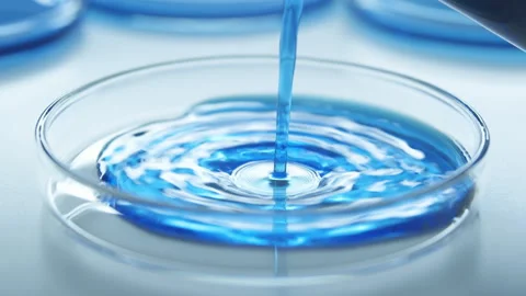Blue Liquid From Laboratory Flask Stock Footage 242804470
