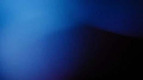 Blue liquid oscillating vigorously against an abstract black background Stock Footage 345518332