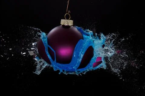 Blue liquid released by an exploding bauble Stock Photos