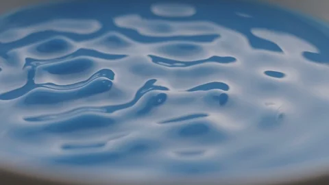Blue Liquid Vibrate on Sounds Waves in Slow Motion Stock Footage 86421636