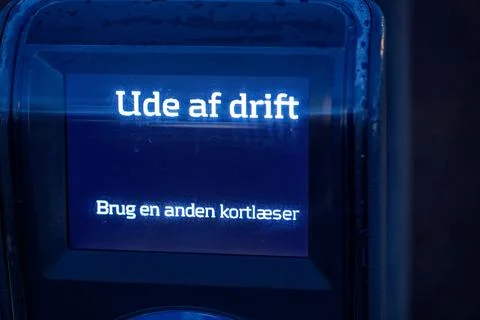 Blue lit card reader displaying ude af drift error message in Danish Stock Photos