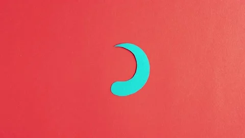 Blue loading icon rotates on red background, stop motion animation. Stock Footage 158700079