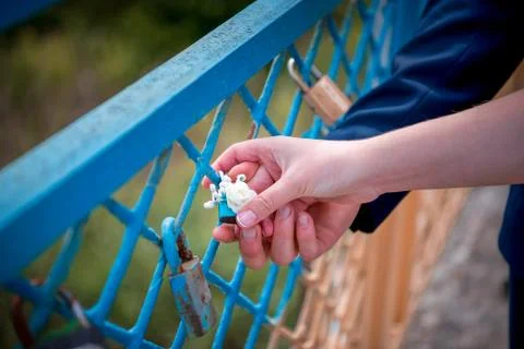 Blue lock wedding and the couple's hands Stock Photos