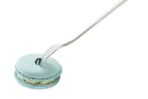 Blue macaron with mint flavour with fork Stock Photos