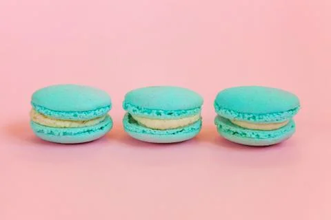 Blue macaron on pink background Stock Photos