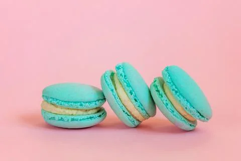 Blue macaron on pink background Stock Photos
