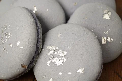 Blue macaroons with silver dust Stock Photos