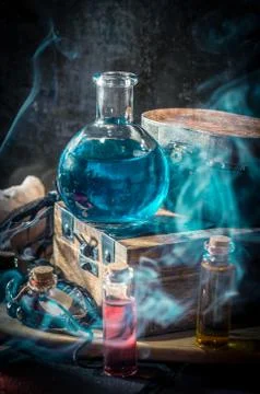 Blue magic potion with smoke Stock Photos
