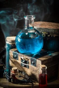 Blue magic potion with smoke Stock Photos