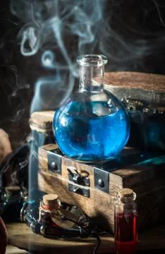 Blue magic potion with smoke Stock Photos