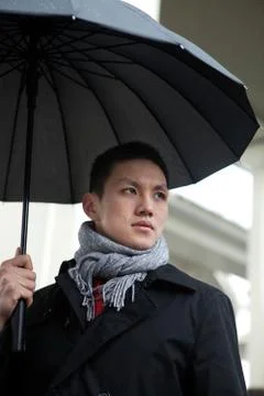The Blue Man of the Year Asians Cold Outdoor Adult Rain Business people Daytime Stock Photos
