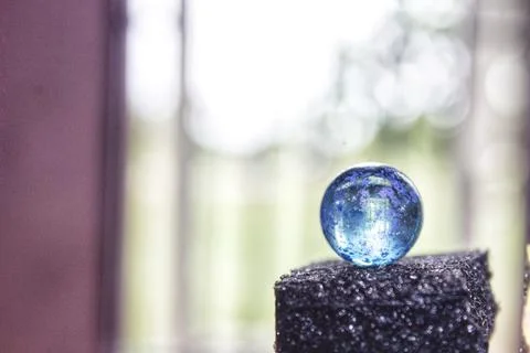 Blue marbles with blur background Stock-Fotos