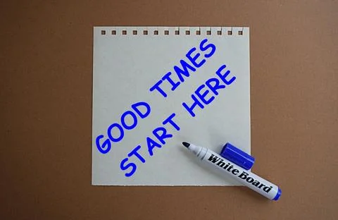 Blue marker and written note good times start here, self development concept Stock Photos