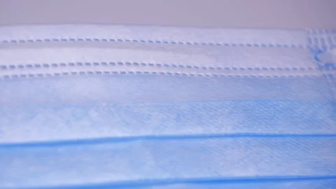 Blue mask, slide left, close up Stock Footage 129607122