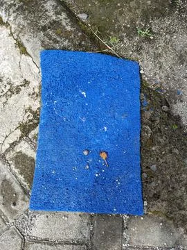 The blue mat is sun-dried during the day Stock Photos