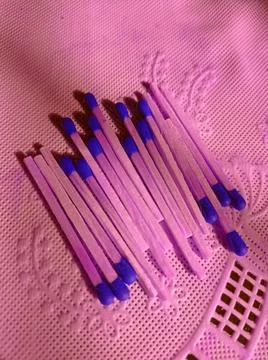 Blue matchsticks on the table Stock Photos