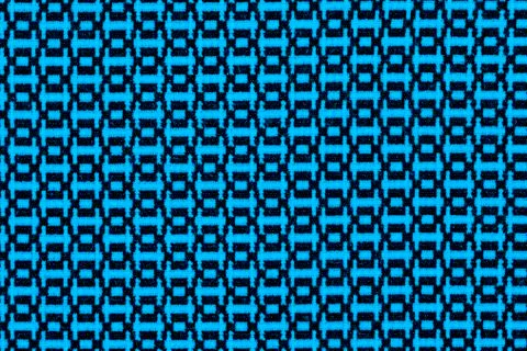 Blue material in geometric patterns, a background or texture Stock Photos