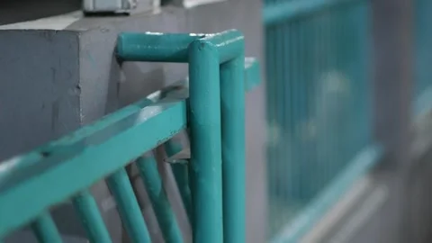Blue Metal Gate Sliding Closed Toward a Concrete Wall Video stock 346504526