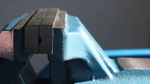 Blue metal vice, bench tools close-up in a workshop. Stock Footage 124207720
