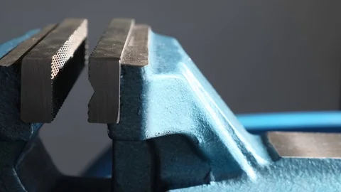 Blue metal vice, bench tools close-up in a workshop. Stock-Footage 124207814