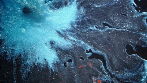 Blue Metallic Ink Burst Spreading Over Dark Liquid Surface Macro Stock Footage 346606705