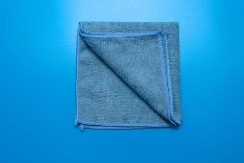 Blue microfiber cloth for different surfaces cleaning in kitchen, bathroom and Stock Photos