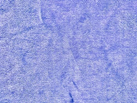 Blue microfiber fabric texture closeup with soft woven fibers subtle folds an Stock Photos