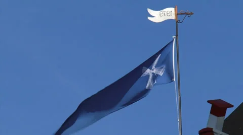 Blue mill flag waving in blue sky, wicks turning Stock Footage 34526391