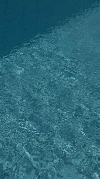 Blue mind pool water texture with sunlit ripples over tiles creating calm t.. Foto stock