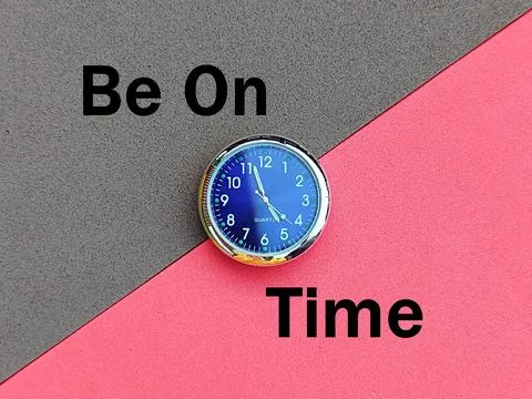 Blue mini clock, bright dark red background and separate inscription be on time Stock Photos