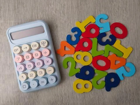Blue mini standard function handheld calculator with colorful number Stock Photos