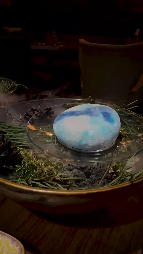 Blue mochi dessert on pine bed with smoke Stock Footage 323525622