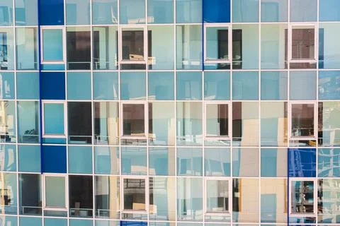 Blue modern ventilated facade with windows. Fragment of a new elite residenti Stock Photos