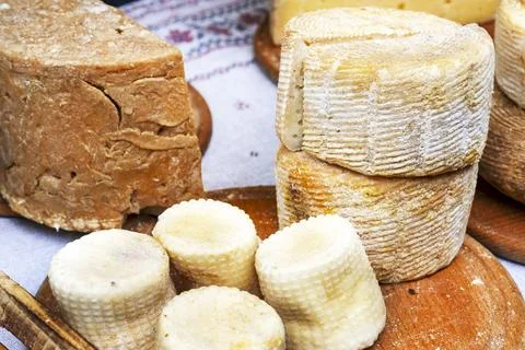 Blue mold cheese. Collection of cheese on wooden board. Stock Photos