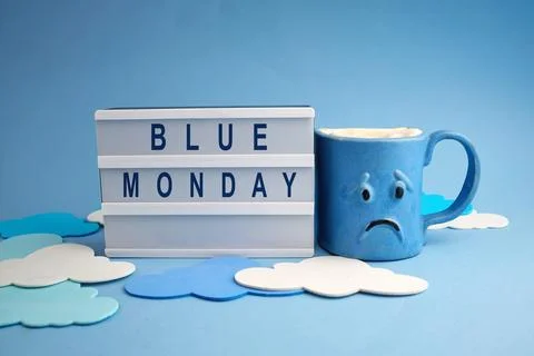 Blue monday lightbox displaying message with sad mug Stock Photos