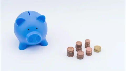 Blue money box and piling up coins Stock Footage 135567790