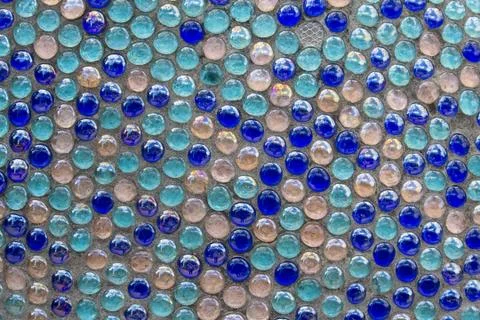 Blue mosaic on a wall close up. Background and texture Stock Photos
