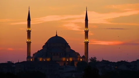 Blue Mosque with lights and a colourful sky at sunset Stock Footage 100829490
