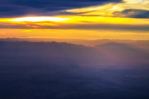 Blue mountain with orange sky while rising sun Foto stock