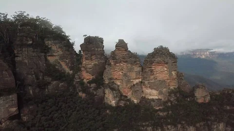 Blue Mountains three sisters in the clouds aerial orbit 2 Stock Footage 124762989